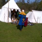 Armour and weaponry on show in various tents.